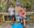 Family surrounds dolphin in Blue Springs