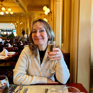 Mom with a glass of champagne Chefs De France in Epcot