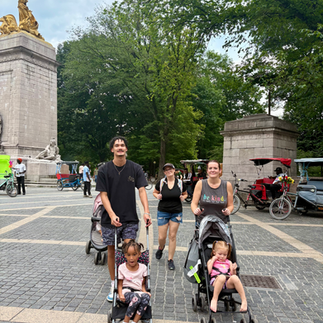 Family with strollers walk Central Park NYC