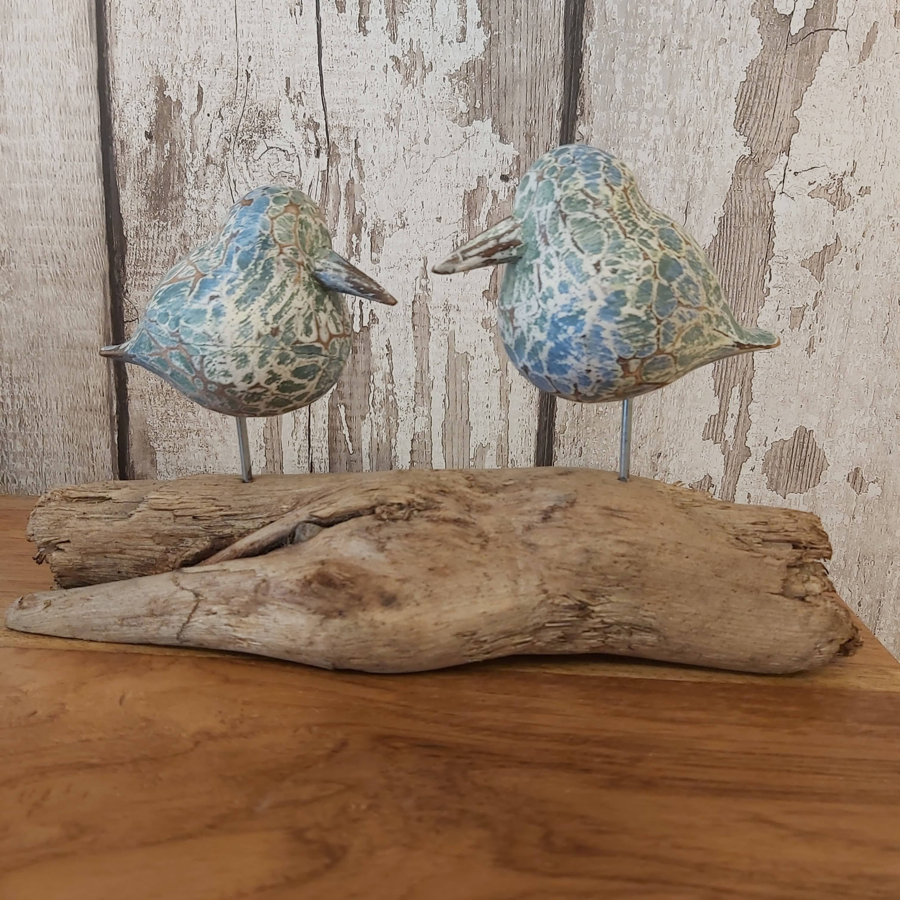 wooden birds on driftwood - green
