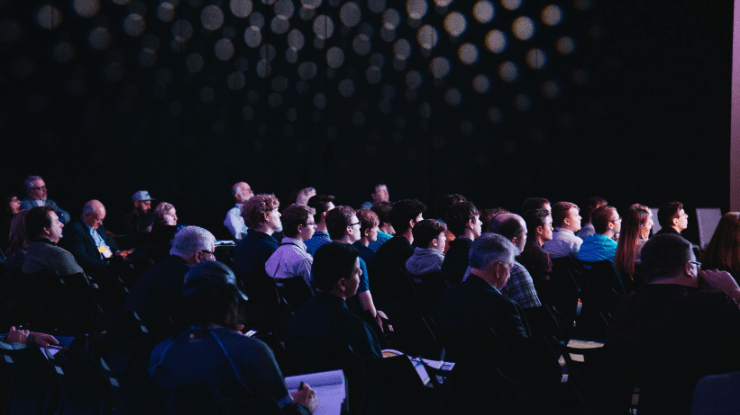 crowd watch presentation at industry event