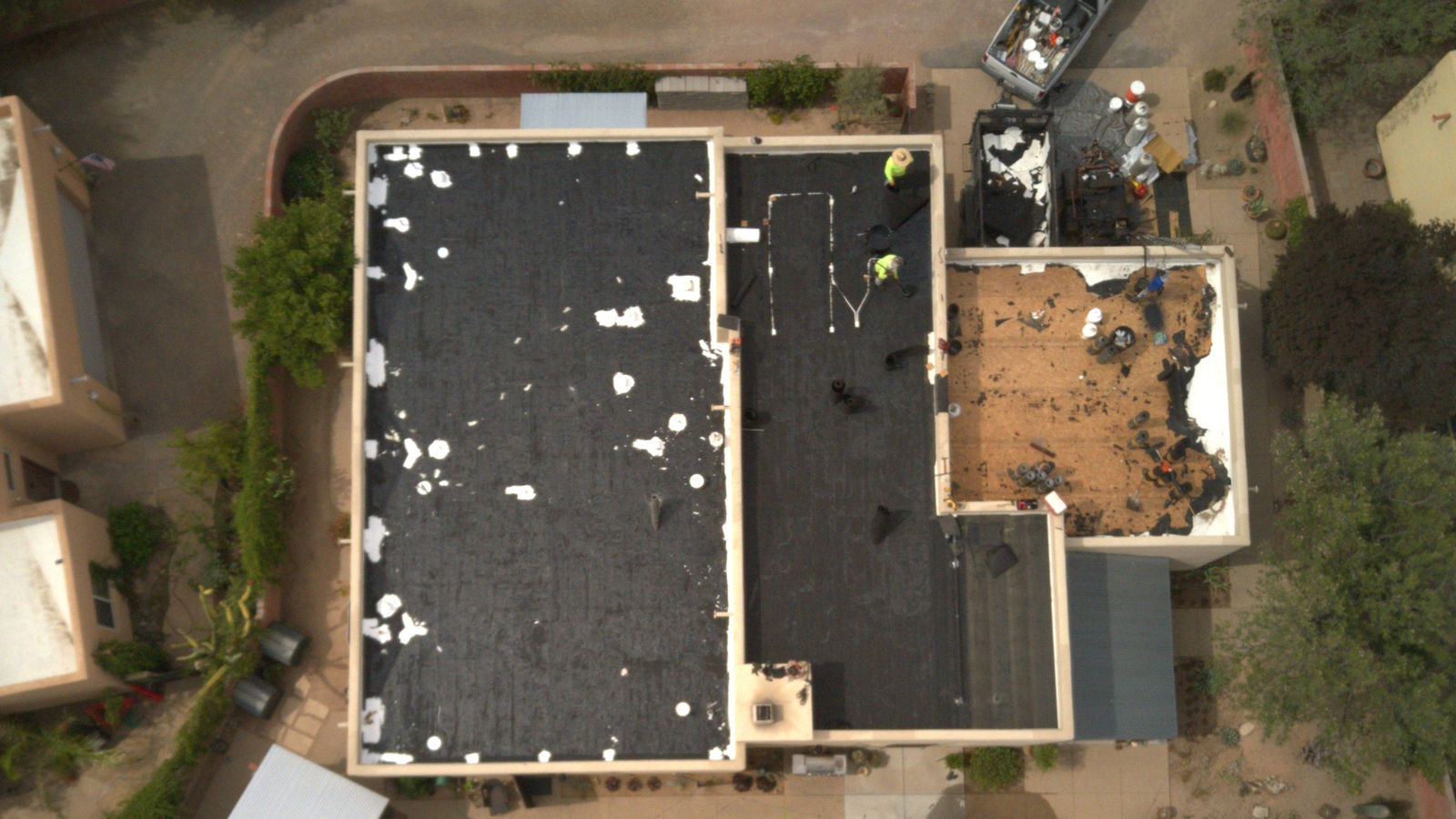 Aerial view of a low-slope roof in the San Pedro Valley