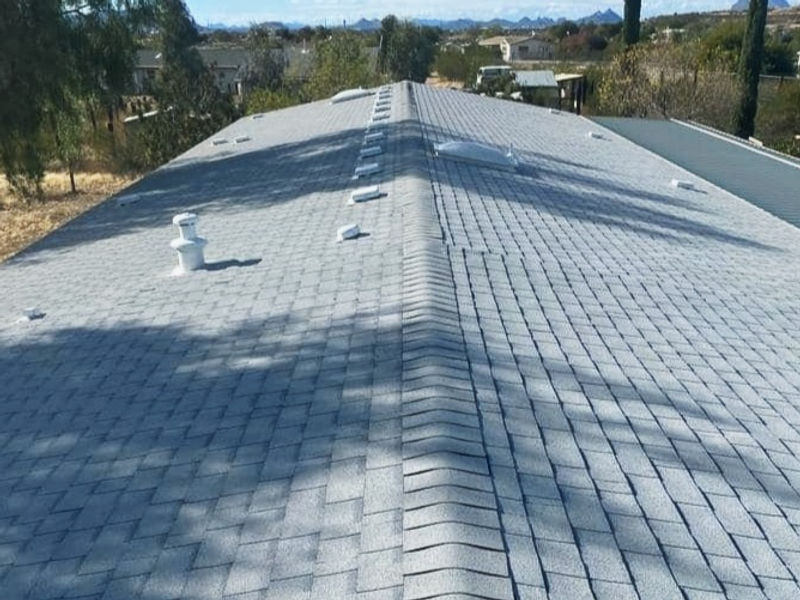 Finished ridge line on a shingle roof