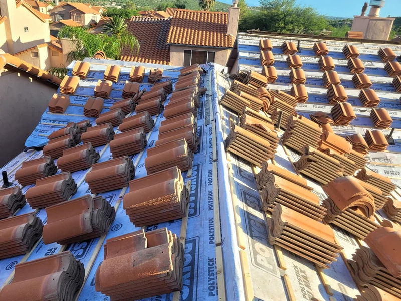 Tiles staged on new underlayment for reinstallation