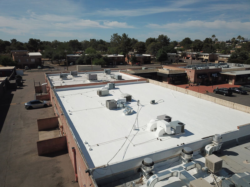 White reflective commercial roof with rooftop HVAC units