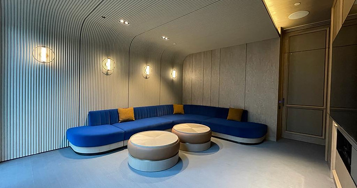 Long Fabric Sofa And Round Wooden Coffee Tables