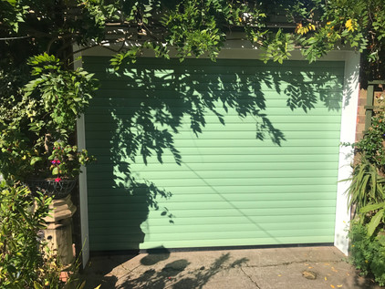 Domestic insulated roller shutter in mint green.