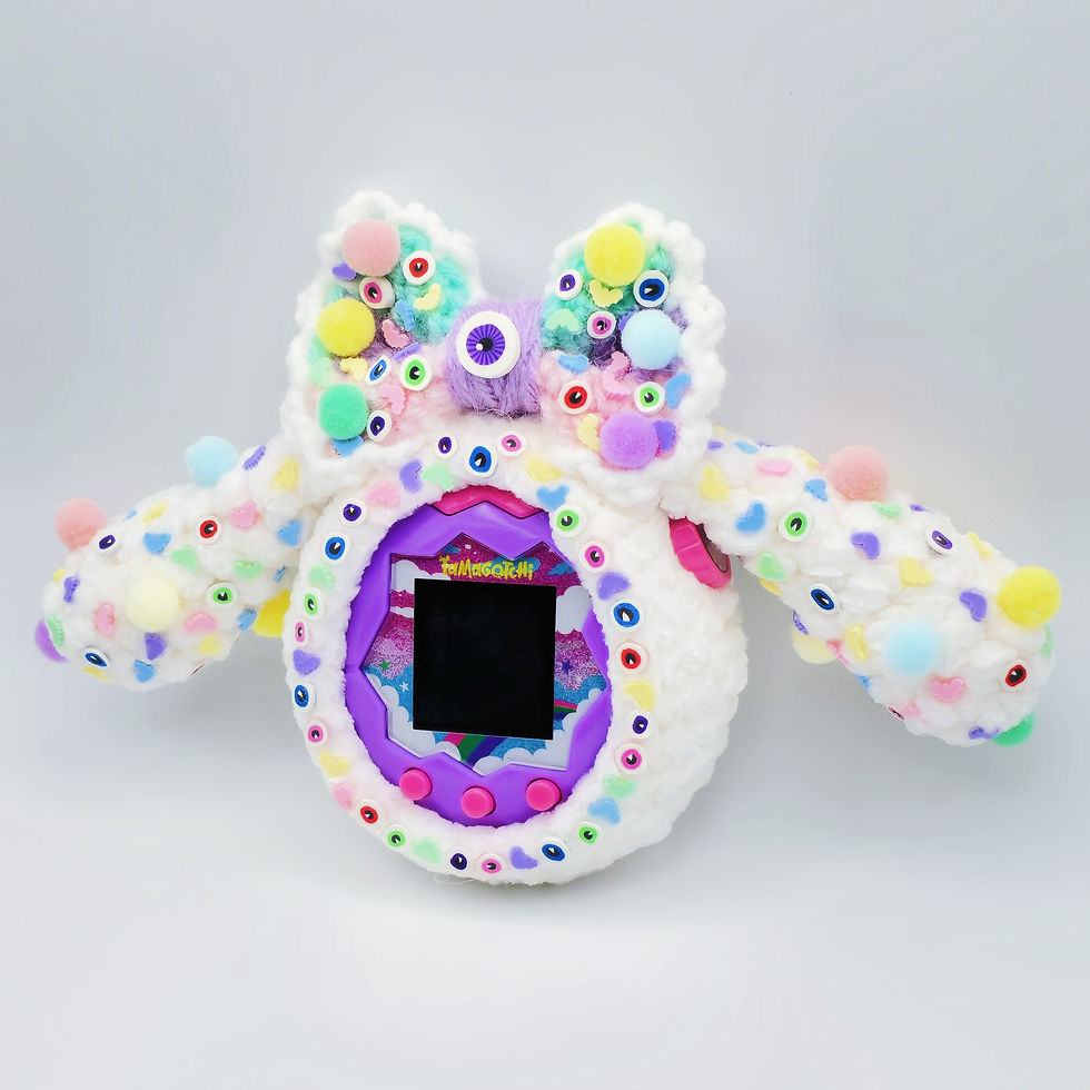 Thumbnail: Pastel Spooky Pom Pom Velvet Tamagotchi Cover