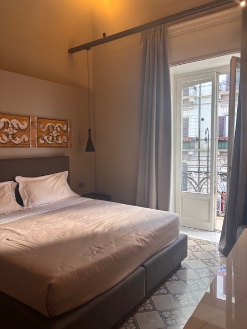 bedroom inside Palazzo Liberty Unique Hotel