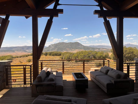 Luxury outdoor furniture installation on a mountain view deck.