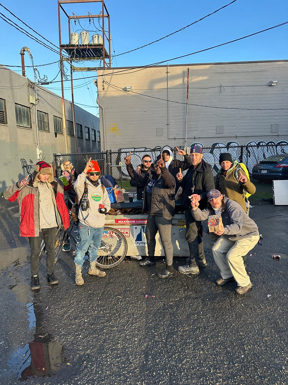 Poverty Exed Project community outreach group gathered together outdoors in Olympia.