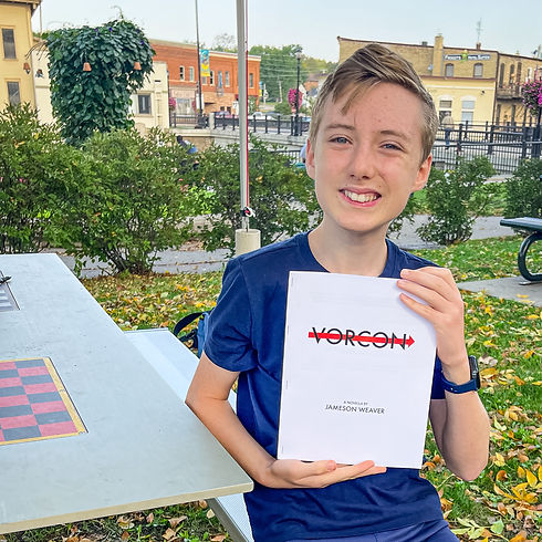 A young vendor poses with his book