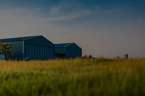 Modern new company warehouse building, farm buildings by the field, outdoors theme concept