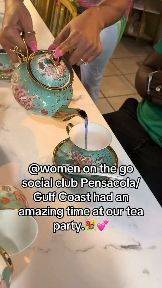 Tea being poured from a floral teapot at a Sonia Faye’s Botanicals tea party in Pensacola.