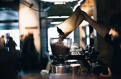 Man Filling up Coffee Beans