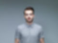 Headshot of Man Wearing a Grey Shirt