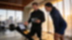English-speaking personal trainer explaining a plan to a client in Zurich