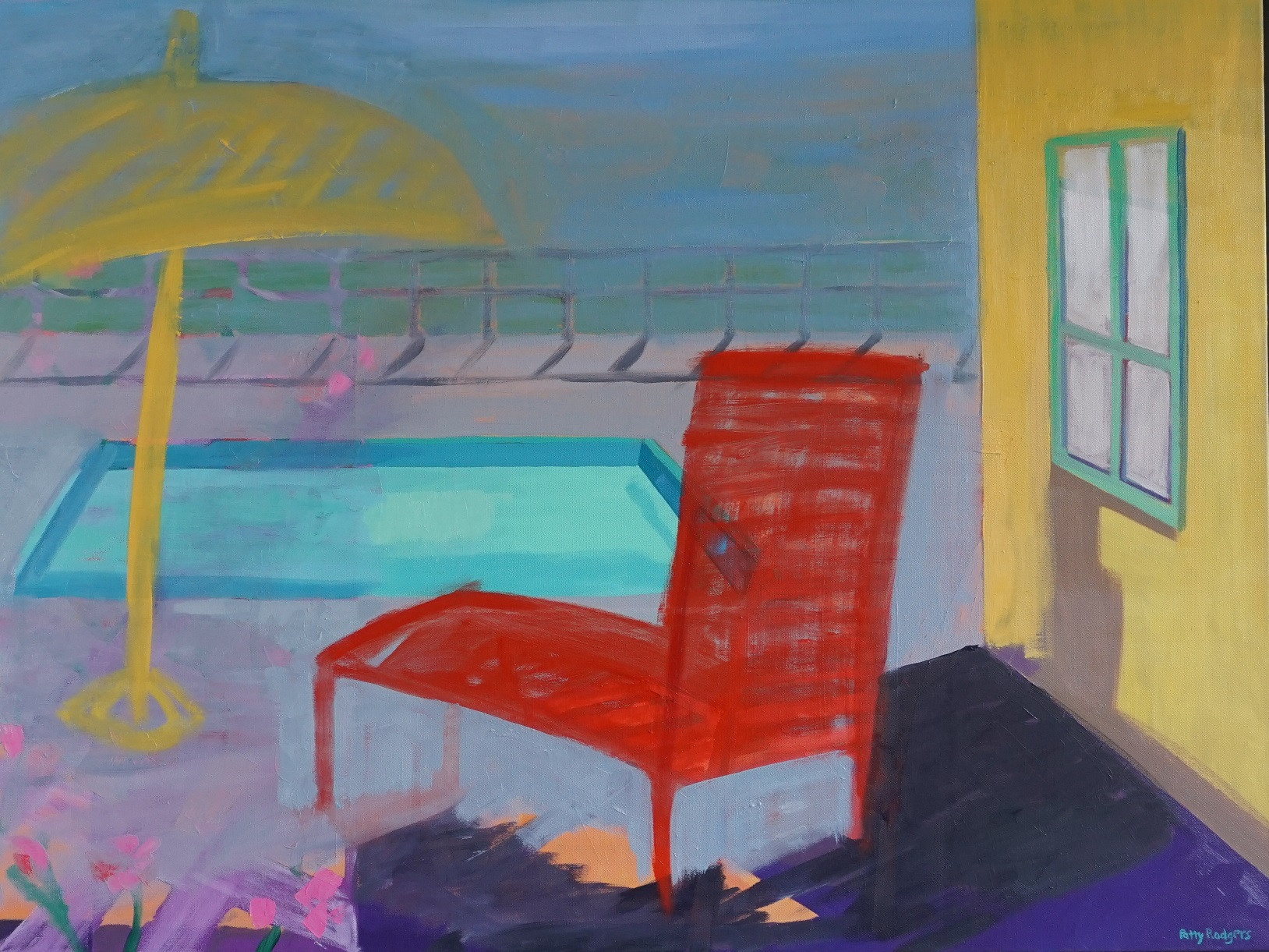 A bright red lawn chair is by a pool in sunlight.
