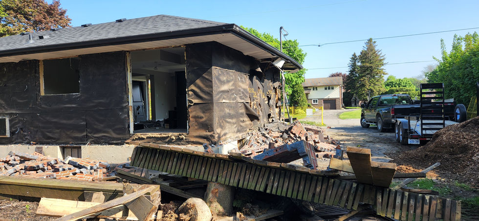 House with debris outside.