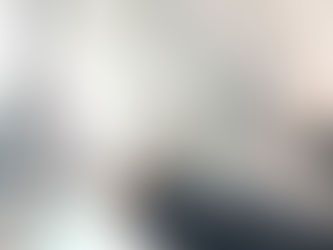 Worker installing or adjusting a window frame.