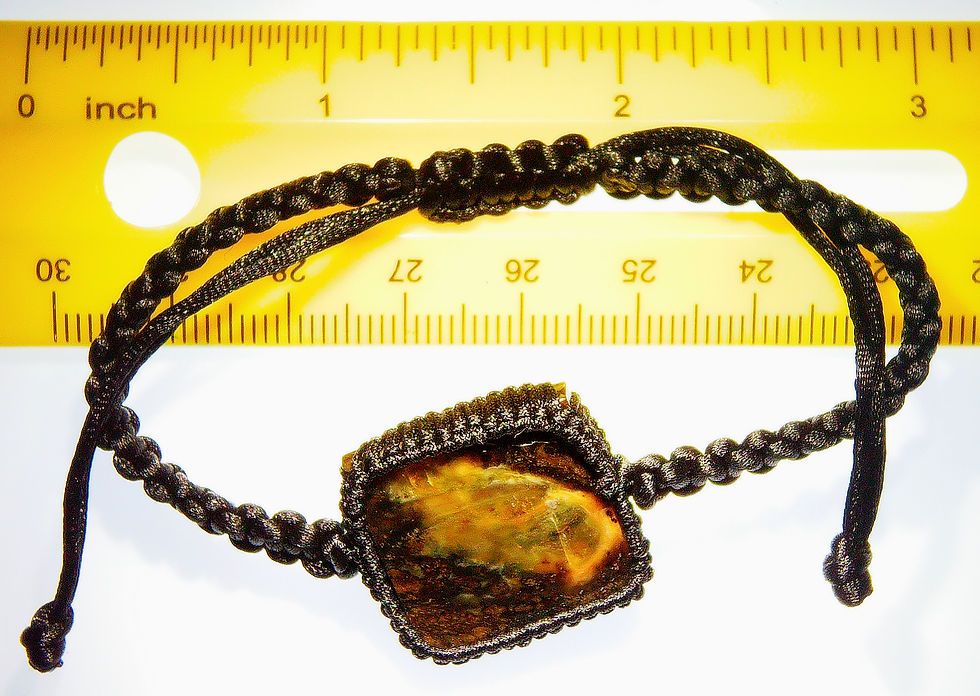 Thumbnail: Burmese coffee amber next to a ruler