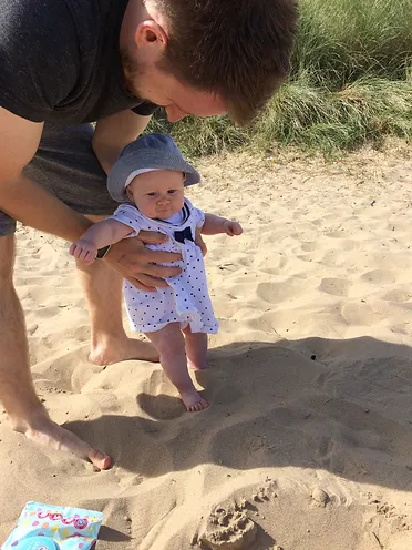 Our four month old daughter on the beach in North Shields