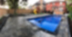 Interlocking stone and fiberglass pool in full backyard renovation