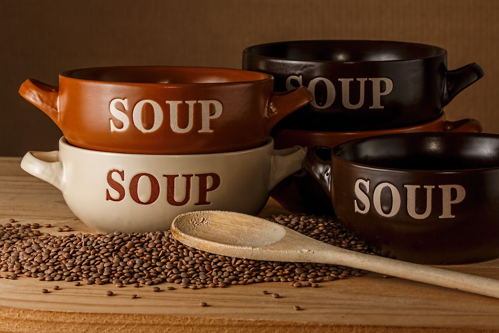 Several soup bowls with lentils on the countertop.