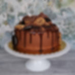 Chocolate drip cake with cookie and brownie stack