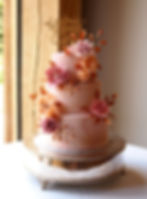Marble fondant wedding cake with handmade sugar flowers and gold leaves