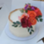 Buttercream cake with gold edging and fresh flowers