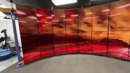 360-degree virtual mars scene displayed on large curved display taking up most of the room