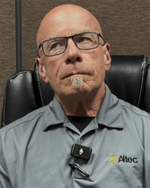 Bill Edwards pauses thoughtfully during his Aging Well Award interview while reflecting on his career, family, and the importance of setting goals.