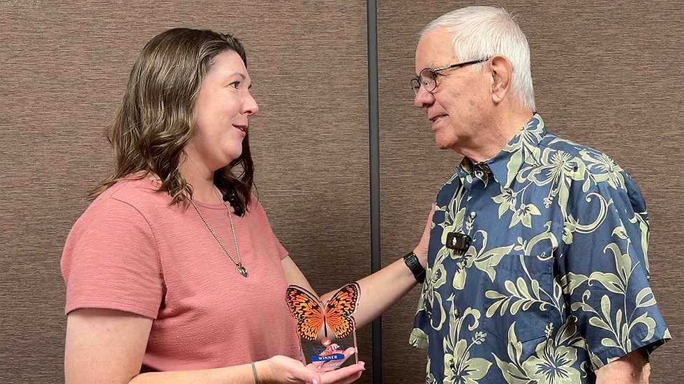 Leah presents Jerry with the Aging Well Award