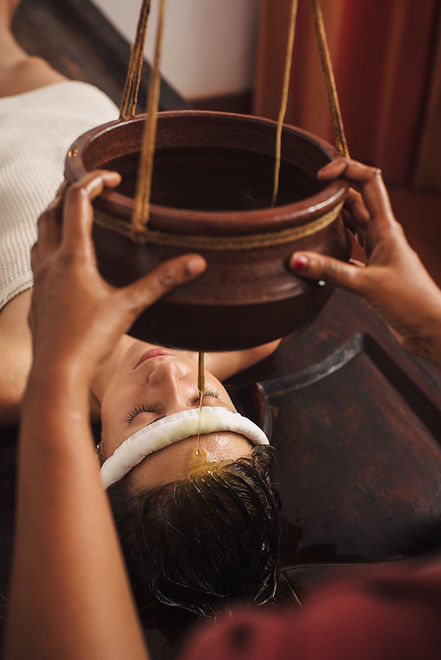 caucasian-woman-having-ayurveda-shirodhara-treatme-2023-11-27-05-29-35-utc.jpg