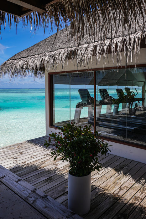 The glass-walled gym looking onto the lagoon