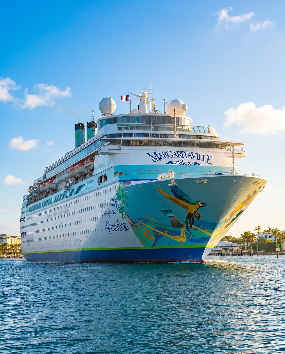 Margaritaville at Sea cruise ship sailing on sunny waters.