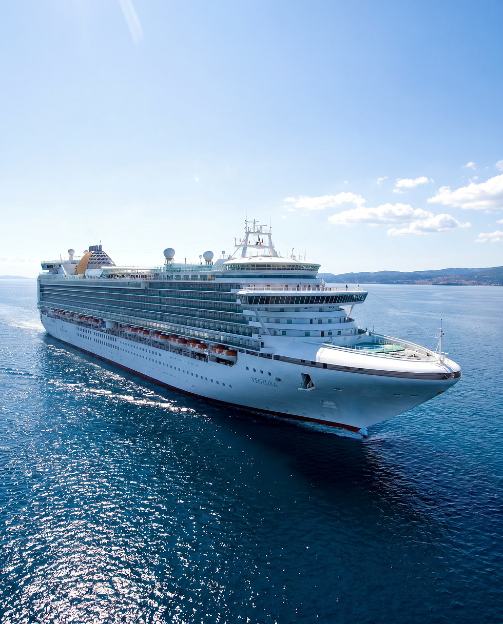 Large white P&O Cruises ship sailing on clear blue water