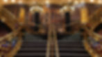 MSC Preziosa opulent staircase with gold railings and mural