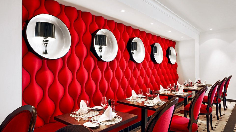 Modern restaurant interior on AIDanova with red wavy walls.
