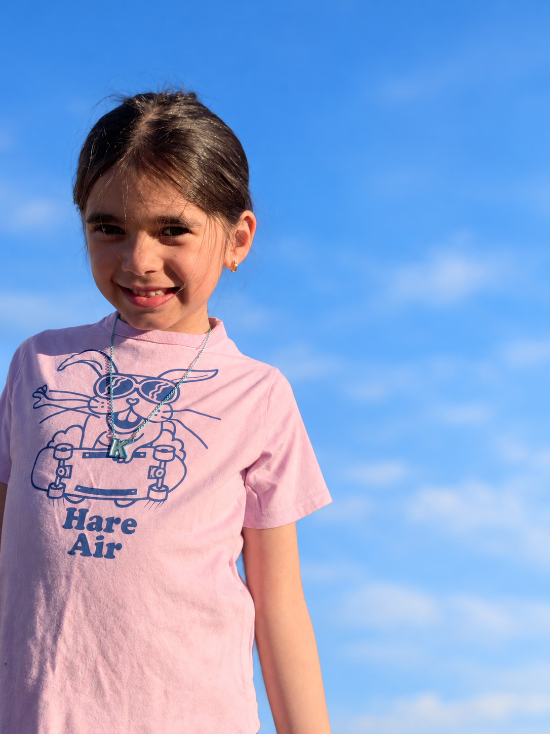 Gap Kids Hare Air graphic T-shirt against a softly blurred blue sky