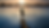 Person balancing on a dock at sunset