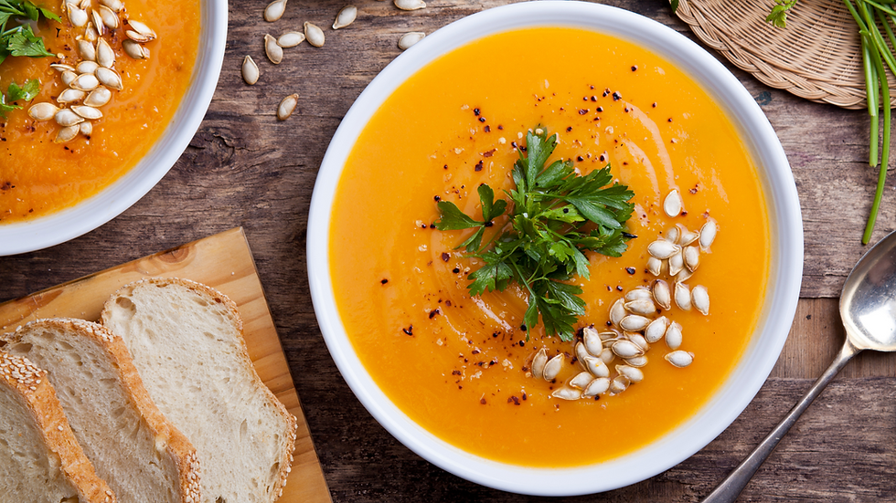 squash soup with roasted pumpkin seeds and rustic bread