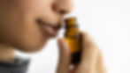woman smelling nasya nose oil drops