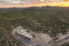Modern home nestled in expansive landscape, scenic sunset, Showcase Home included.