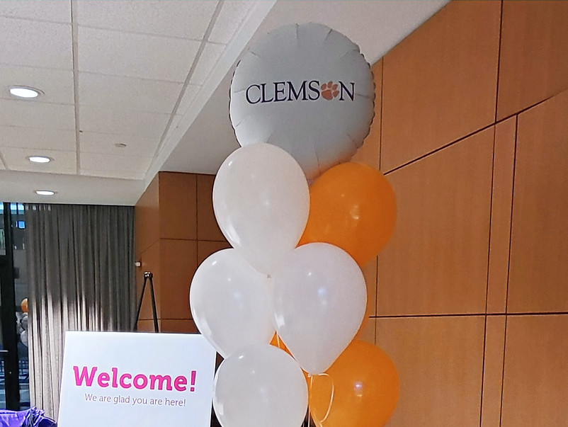 Clemson balloons and welcome sign for rentals event