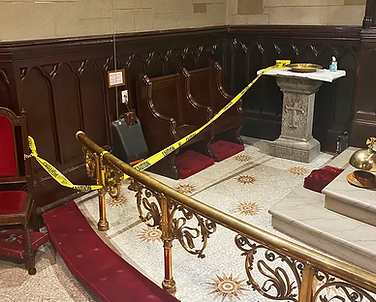 Caution tape spread across church altar space