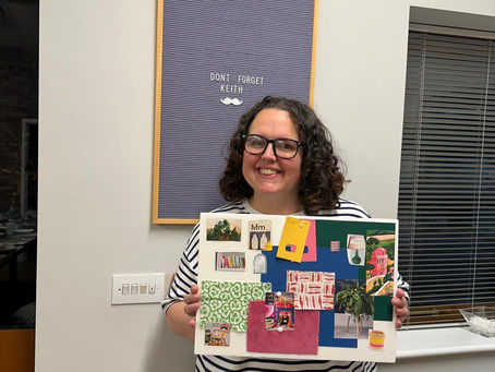 A woman with ADHD holding a creative craft she has made