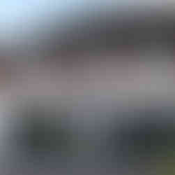 the outside of our stratofrd-upon-avon showroom featuring a white fronted building with large grey windows