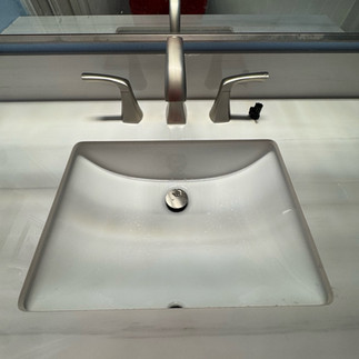 New bathroom vanity sink and faucet installed during an upstairs bathroom plumbing trim-out project in Schertz Texas.